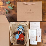 Bracken Moss Pebblewood collectible bear with kraft packaging, Certificate of Authenticity, Resident Card and care details.