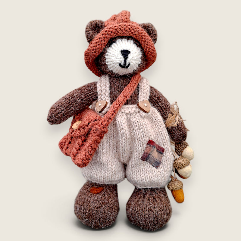 Bramble Rowan handmade collectible bear wearing patched dungarees and carrying needle-felted acorns.