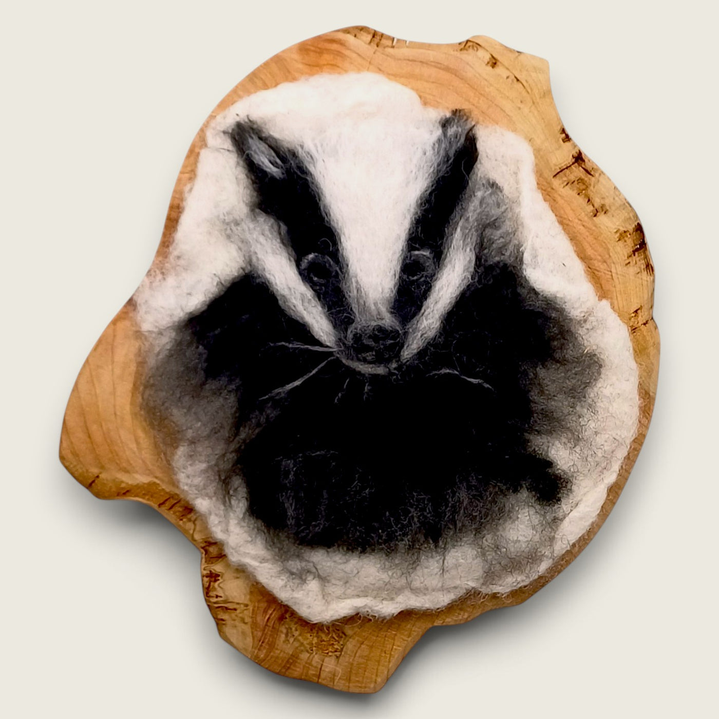 Dara needle felted badger in natural merino wool mounted on cherry timber, handmade in the Boyne Valley, Ireland.