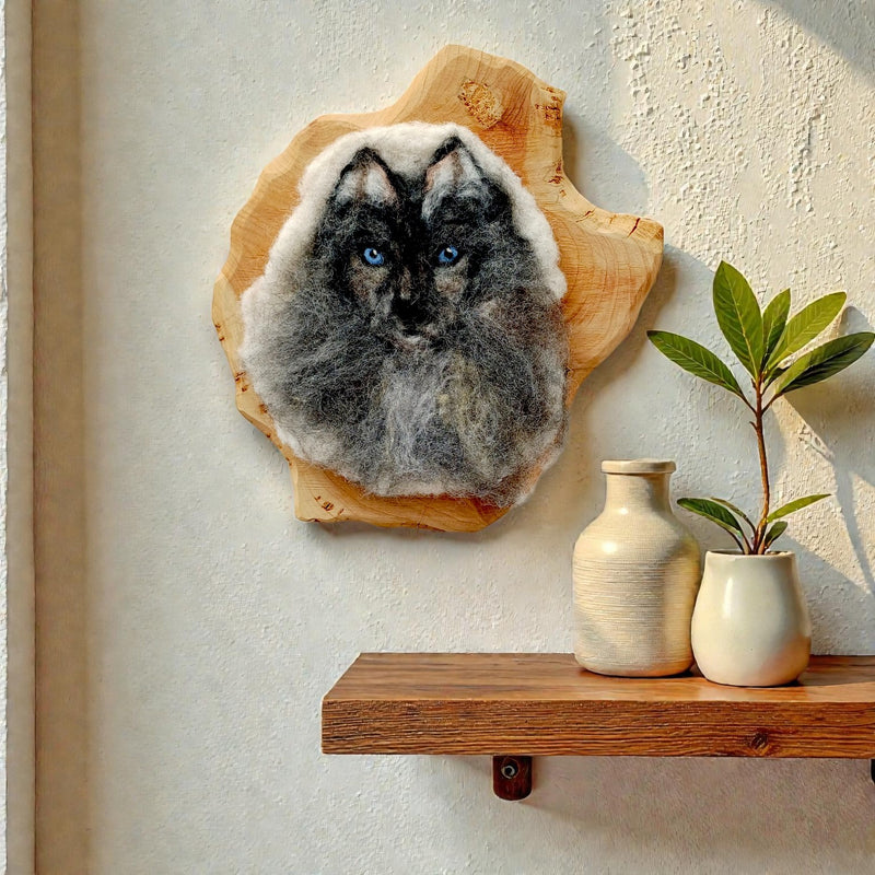 Faela needle felted wolf face wall art displayed in home interior - handmade Irish wildlife fibre art by The Crafty Pebblers