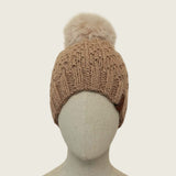 Fawn handknitted alpaca and wool hat with a mink-coloured faux fur pompom, front view