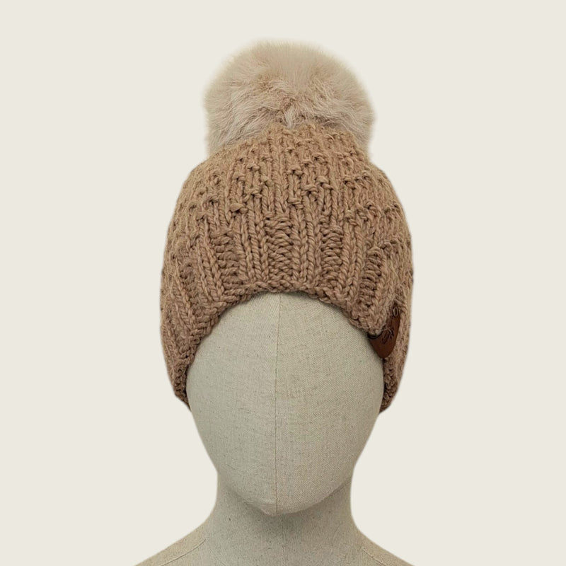 Fawn handknitted alpaca and wool hat with a mink-coloured faux fur pompom, front view