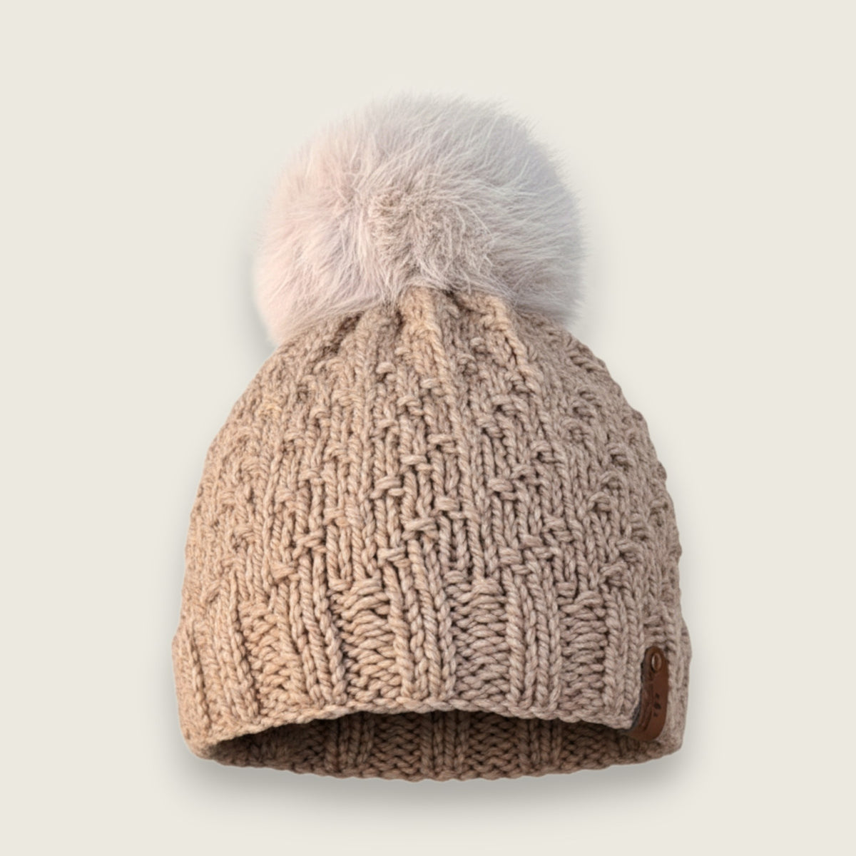 Fawn handknitted alpaca and wool hat with a mink faux fur pompom, front view