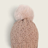 Fawn alpaca and wool hat with mink pompom, front view on a plain ground