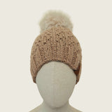 The fawn hat on a mannequin, showing its full shape from brim to pompom