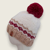 Fawn and burgundy colourwork alpaca and wool hat with a burgundy pompom, side view