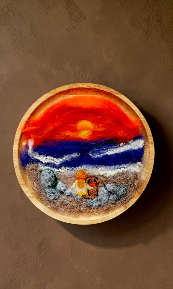 Handcrafted felt and fibre art seascape in a round wooden frame, handmade by The Crafty Pebblers in the Boyne Valley, Ireland.