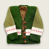 Green merino toddler cardigan with red heart detail and check lining