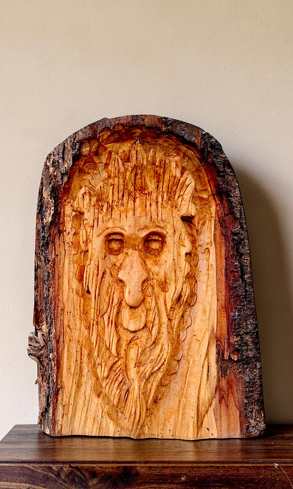 Hand-carved forest face in natural live-edge timber, handmade by The Crafty Pebblers in the Boyne Valley, Ireland.