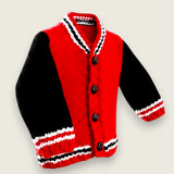 Angled front view of red and black alpaca and wool toddler jacket with black buttons.