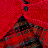 Handknitted merino capelet with red tartan lining