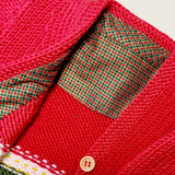 Red merino baby cardigan neckline with printed check fabric detail