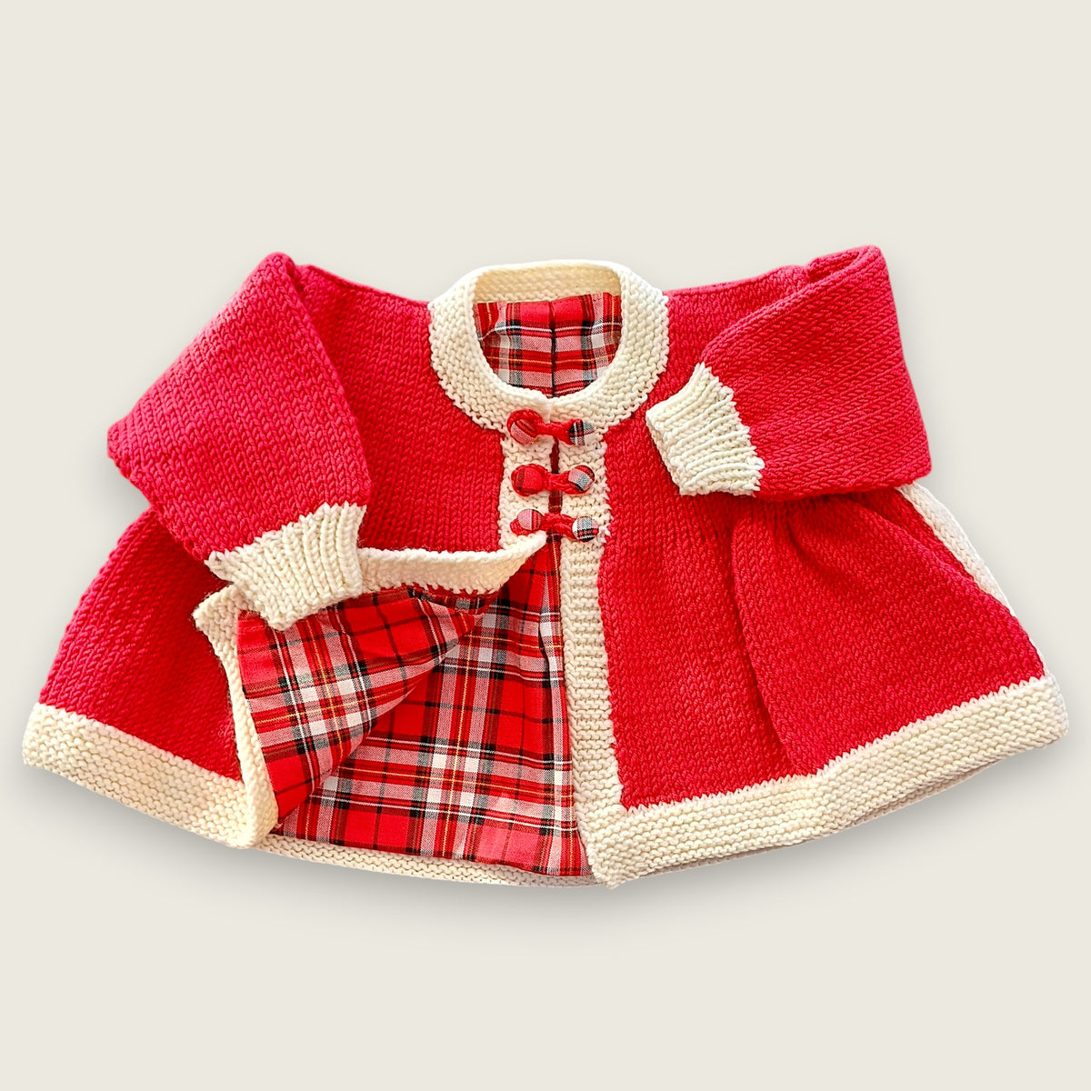 Red merino wool baby matinee coat with natural ecru trim