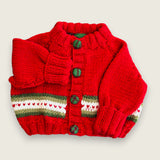 Red merino newborn cardigan laid flat with heart detail and tartan buttons