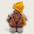 Back view of Hazel Hollow Pebblewood collectible bear showing his hand-knitted brown dungarees, mustard hat and satchel.