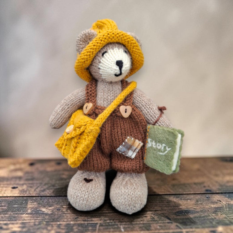 Hazel Hollow, the Pebblewood Story Keeper, displayed with his hand-knitted clothing, satchel and needle-felted book of stories.