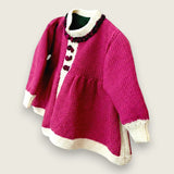 Side view of magenta merino wool baby matinee coat