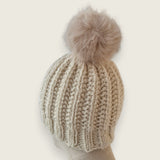 Back view of the natural hat, showing the false rib stitch from brim to crown