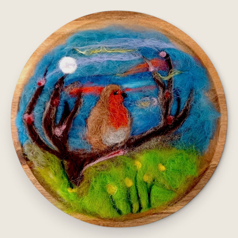 Needle felted wool picture of a robin in a flowering meadow, handcrafted in the Boyne Valley, Ireland and presented in a wooden frame.