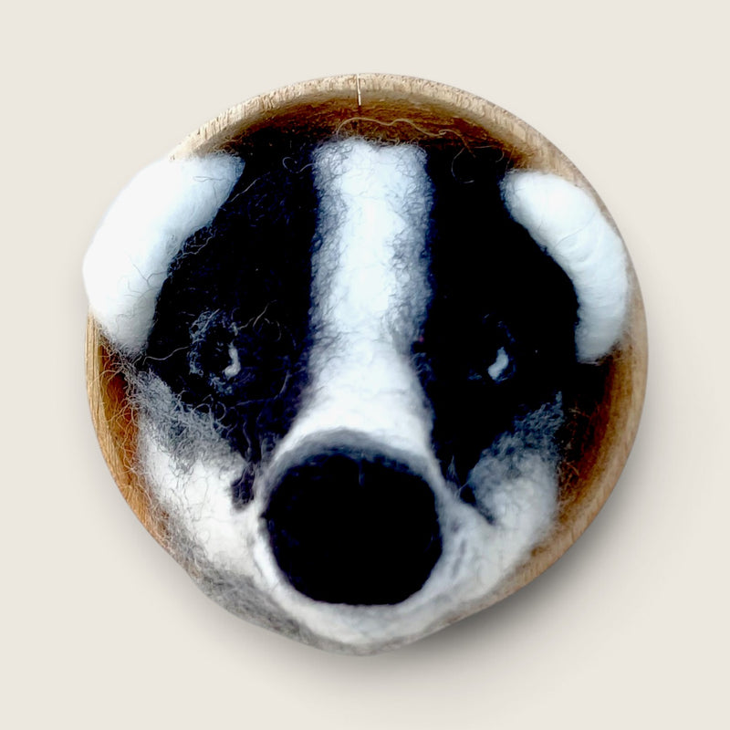 Hand needle-felted badger fibre art created from natural merino and Corriedale wool, mounted in a hand-finished wooden bowl in the Boyne Valley, Ireland.