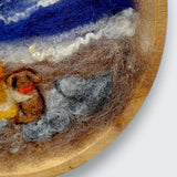 Needle felted wool picture of girl and dog watching sunset showing natural wood grain of round wooden plate mount - handmade in Co. Meath Ireland