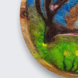 Needle felted wool picture of robin in flowering meadow showing natural wood grain of round wooden plate mount - handmade in Co. Meath Ireland by The Crafty Pebblers