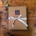 Pebblewood collectible bear kraft presentation box finished with ribbon and The Crafty Pebblers branding.