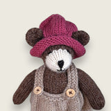 Pebblewood Resident wearing hand knitted berry wool hat
