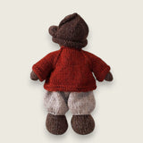 Rear view of Pebblewood Resident wearing dark rust wool wildflower cardigan