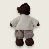 Back view of ecru wool cardigan worn by a Pebblewood Resident