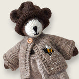 Fawn wool bear cardigan with hand-embroidered bee shown on Pebblewood Resident