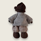 Back view of light grey wool cardigan worn by a Pebblewood Resident