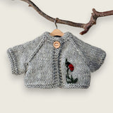 Light grey wool cardigan with hand-embroidered ladybird and leaf detail