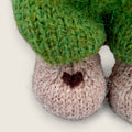 Close-up of Pip Elder's needle-felted heart detail on the right paw.