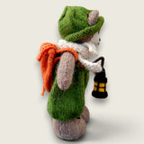 Right side view of Pip Elder, Pebblewood Elder Resident, showing his hand-knitted clothing, round glasses and needle-felted lantern.