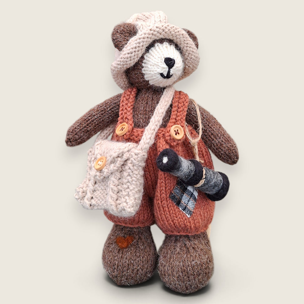 Swallow Flight handmade collectible bear wearing dark salmon patched dungarees and carrying a needle-felted telescope.