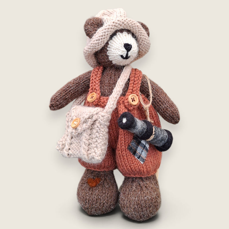 Swallow Flight handmade collectible bear wearing dark salmon patched dungarees and carrying a needle-felted telescope.