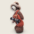 Left side view of Swallow Flight handmade collectible bear showing knitted satchel and pointed hat.