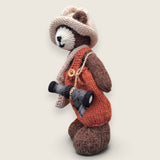 Left side view of Swallow Flight handmade collectible bear showing knitted satchel and pointed hat.