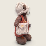 Right side view of Swallow Flight handmade collectible bear with handcrafted clothing and accessories.