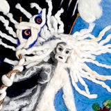Close view of the Cailleach's sculpted face and the twisted wooden staff