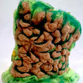 Back view of The Living Fall 3D felted wool sculpture showing the needle-felted rock face and layered green wool landscape.