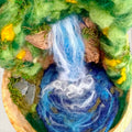 Close-up of The Living Fall showing the needle-felted waterfall, swirling pool, rock faces, wildflowers and moss details.