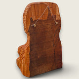 Back view of The Woodlander lime wood sculpture showing the natural timber and fitted wire for wall hanging.