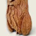 Close-up of The Woodsman showing the individually hand-carved facial features, moustache, beard and detailed cap.