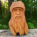 The Woodsman original hand-carved lime wood sculpture displayed in a natural home interior setting.