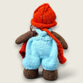 Rear view of Thorne Ash, Pebblewood Village Messenger, showing his hand-knitted clothing.