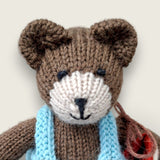 Close-up of Thorne Ash showing the individually finished face of the hand-knitted Pebblewood collectible bear.