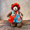 Thorne Ash, Pebblewood Village Messenger, displayed with his hand-knitted clothing, satchel and handmade felt envelope and letter.