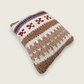 Hand-knitted cushion designed and made by Pat especially for Willow Hearth in coordinating natural wool colours.